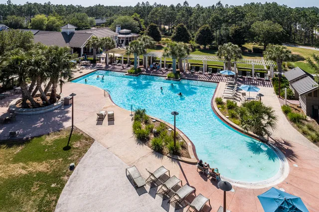 an aerial view of a golf course with swimming pool