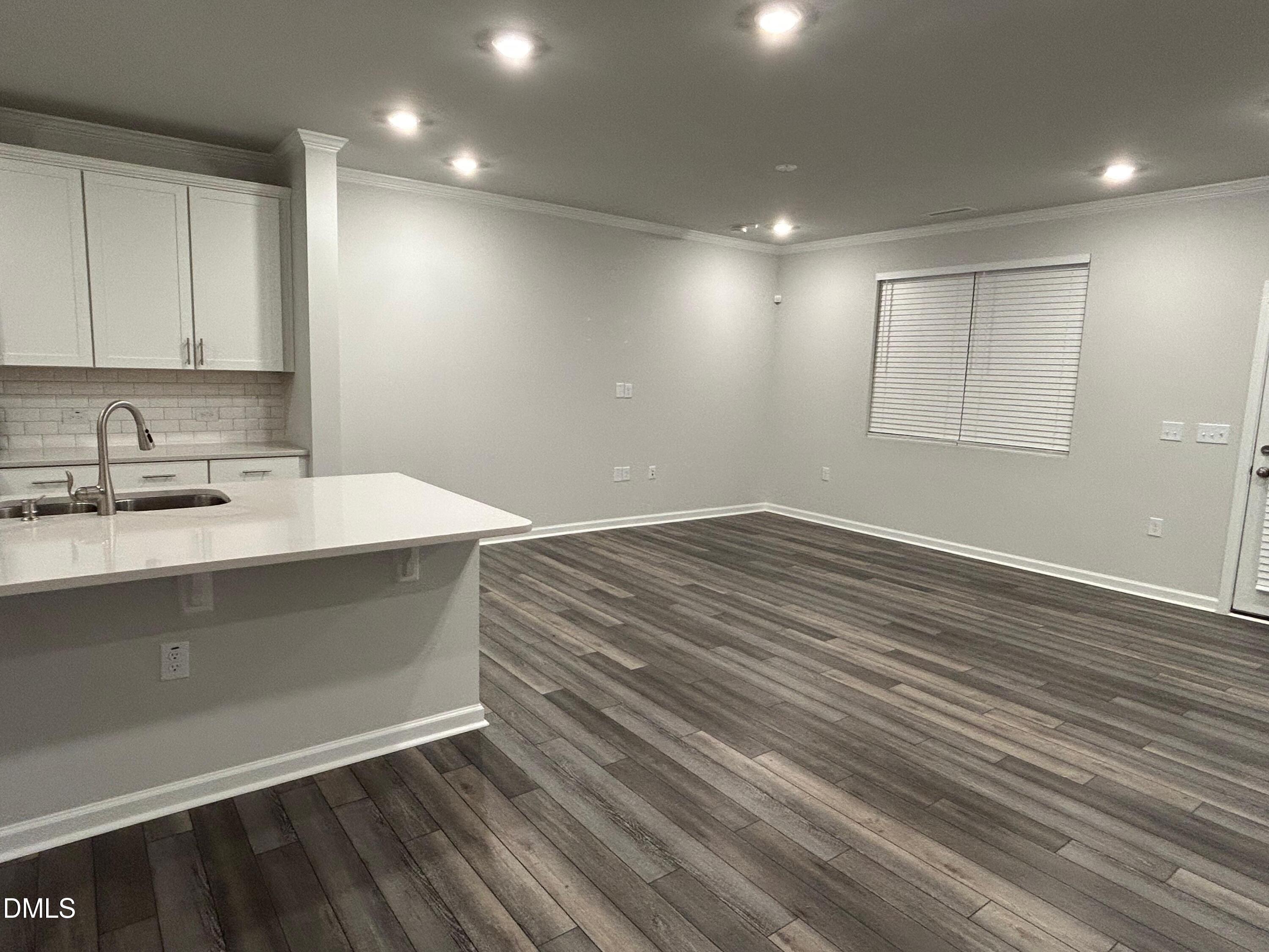 113 Vanilla Orchid Lane Garner, NC 27529 - Photo 15 of 32 a bathroom with a sink and a mirror