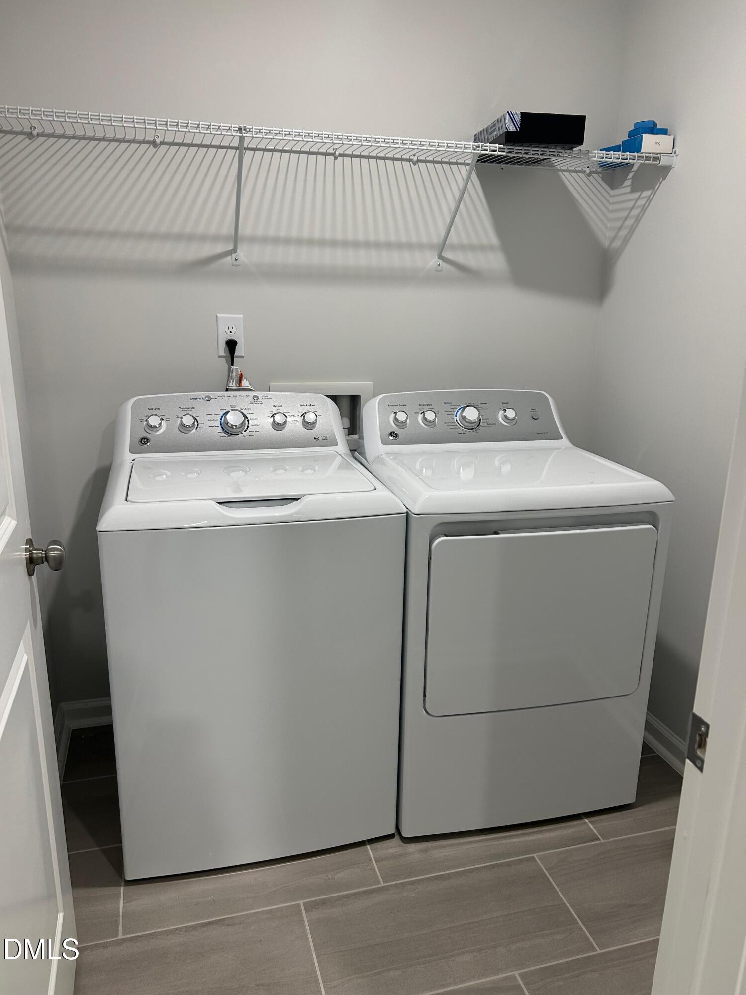 113 Vanilla Orchid Lane Garner, NC 27529 - Photo 21 of 32 a utility room with dryer and washer