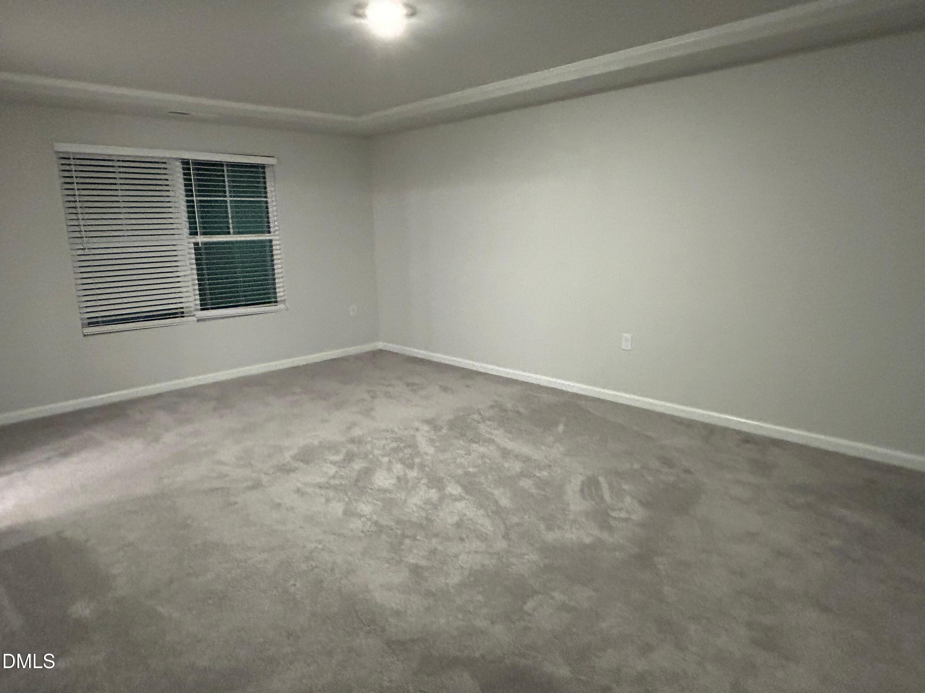 113 Vanilla Orchid Lane Garner, NC 27529 - Photo 22 of 32 an empty room with windows