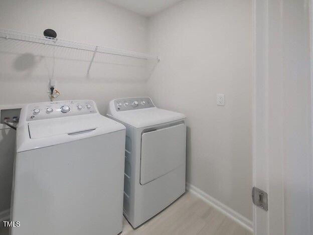 113 Vanilla Orchid Lane Garner, NC 27529 - Photo 7 of 32 a utility room with dryer and washer