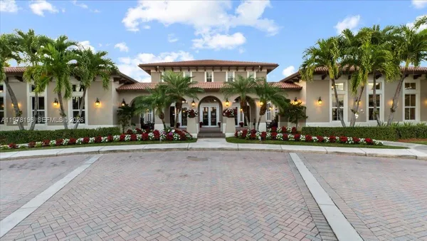 a group of people sitting in front of a building