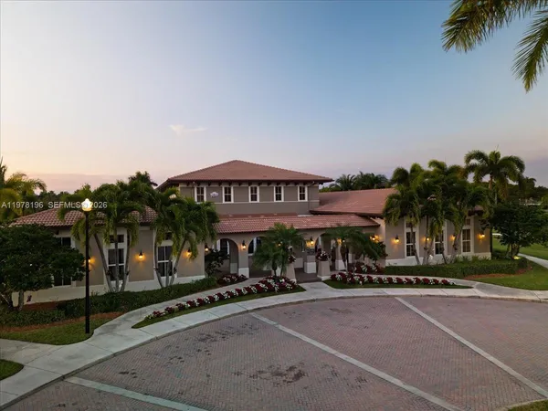 an aerial view of a swimming pool patio and outdoor seating