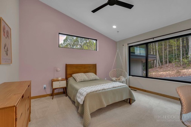799 Milton Brown Heirs Road Boone, NC 28607 - Photo 28 of 49 a bedroom with a bed and a large window