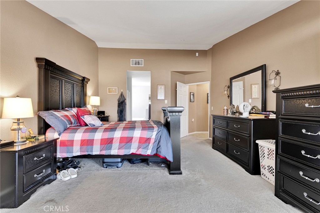 20403 Ochoa Road Apple Valley, CA 92307 - Photo 29 of 48 a bedroom with a bed and dresser
