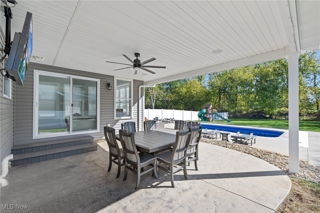 3124 Huntcliffe Road Northeast Canton, OH 44721 - Photo 30 of 35 View of patio with a fenced in pool and ceiling fan