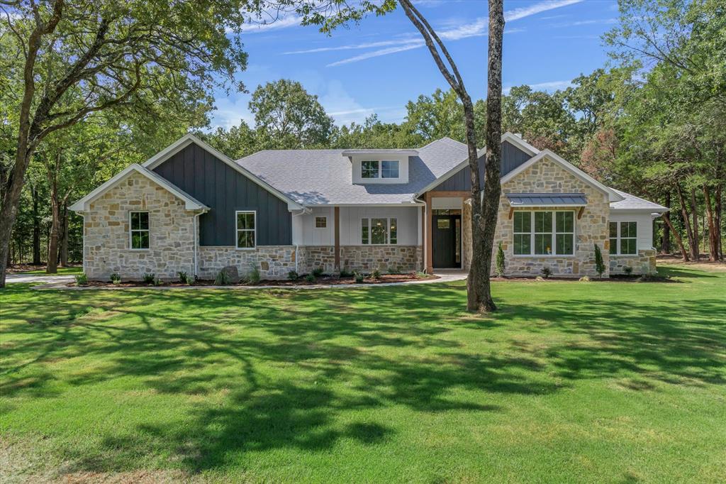 325 Legacy Lane Edgewood, TX 75117 - Photo 1 of 39 a front view of a house with a garden