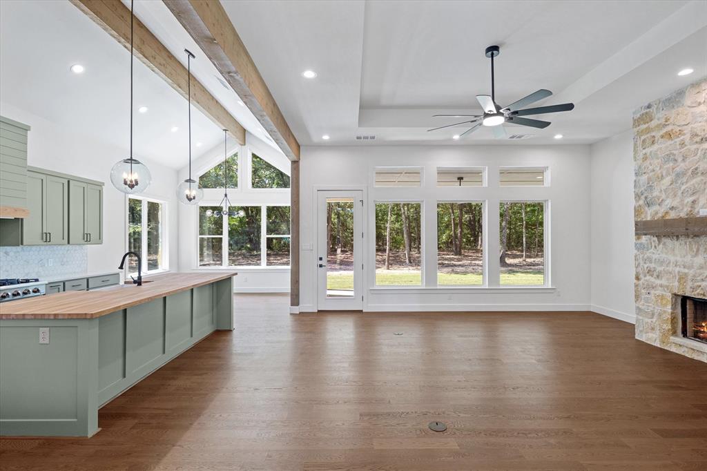 325 Legacy Lane Edgewood, TX 75117 - Photo 11 of 39 a large kitchen with stainless steel appliances granite countertop a large window