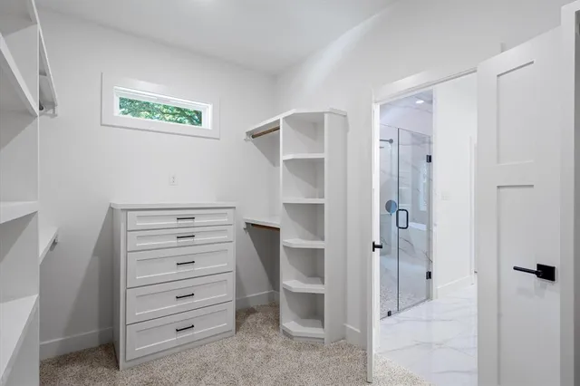 a view of an empty walk in closet