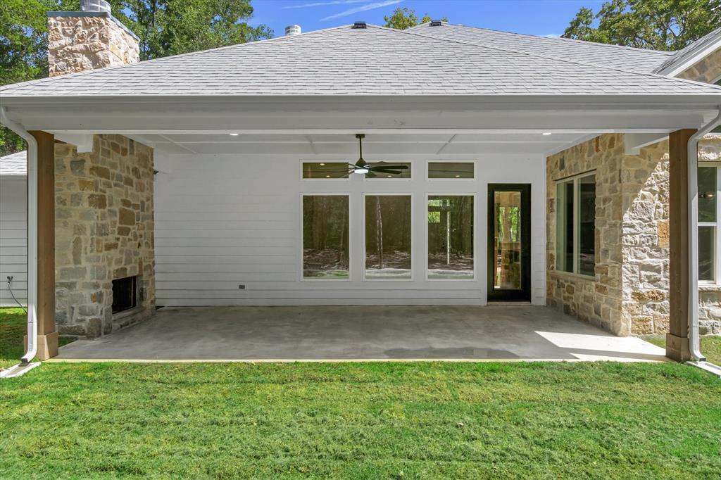 325 Legacy Lane Edgewood, TX 75117 - Photo 27 of 39 a front view of a house with a garden