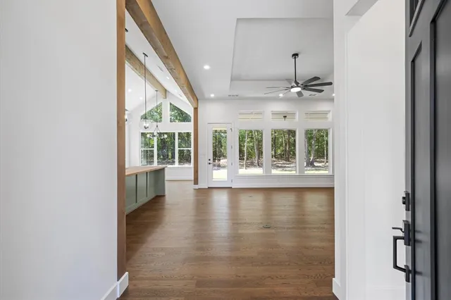 a view of an entryway with wooden floor