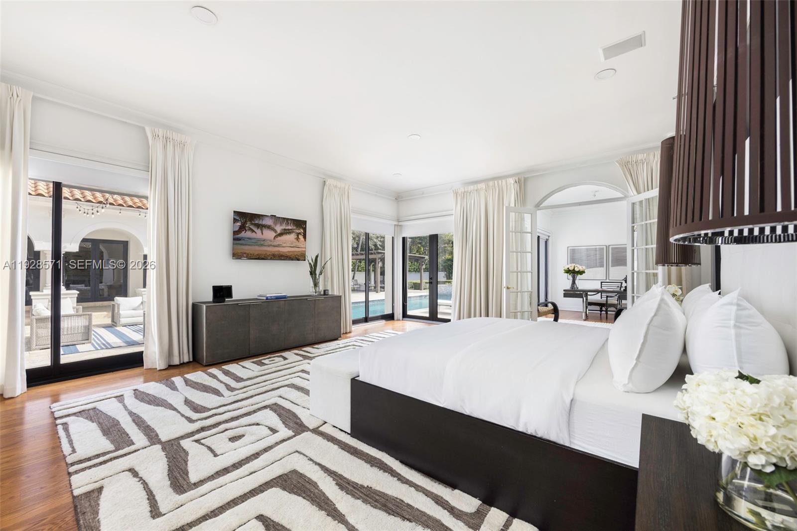 7430 Southwest 66th Street Miami, FL 33143 - Photo 14 of 43 a bedroom with a bed and window