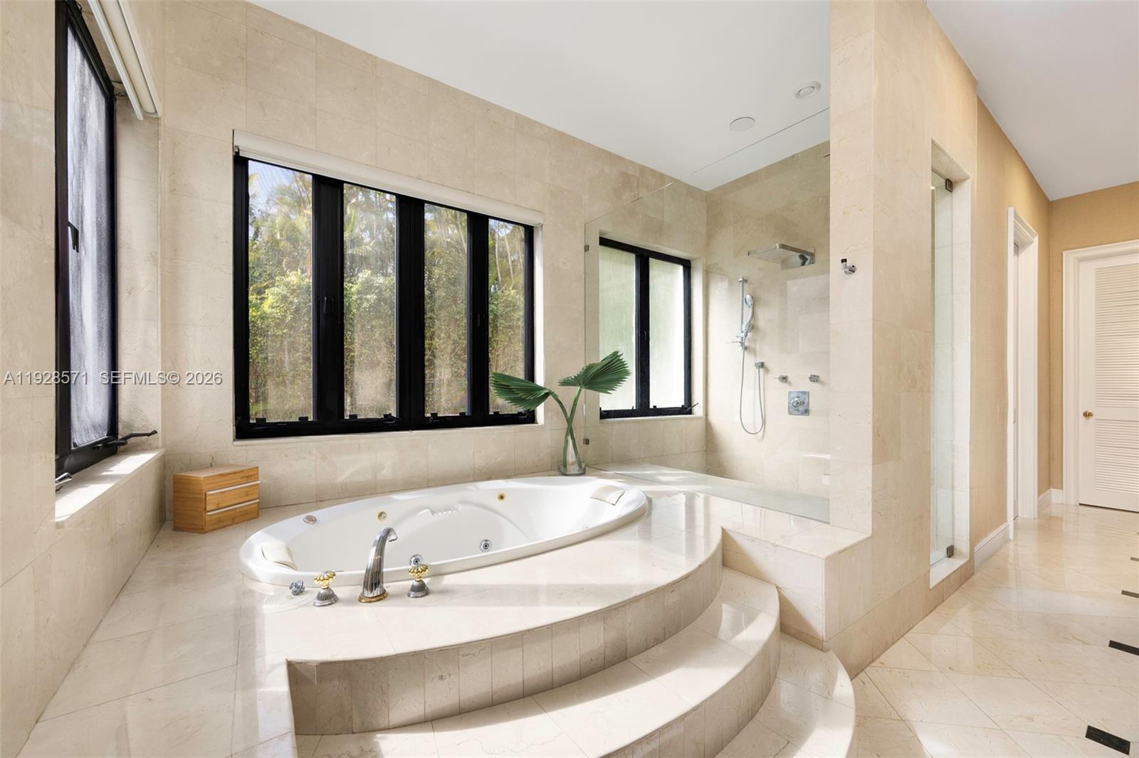 7430 Southwest 66th Street Miami, FL 33143 - Photo 18 of 43 a bath tub sitting in a bathroom next to a window