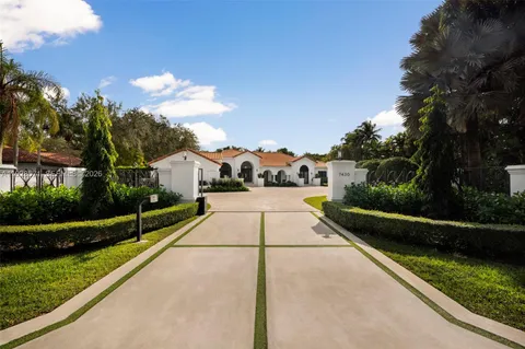 a view of house with yard
