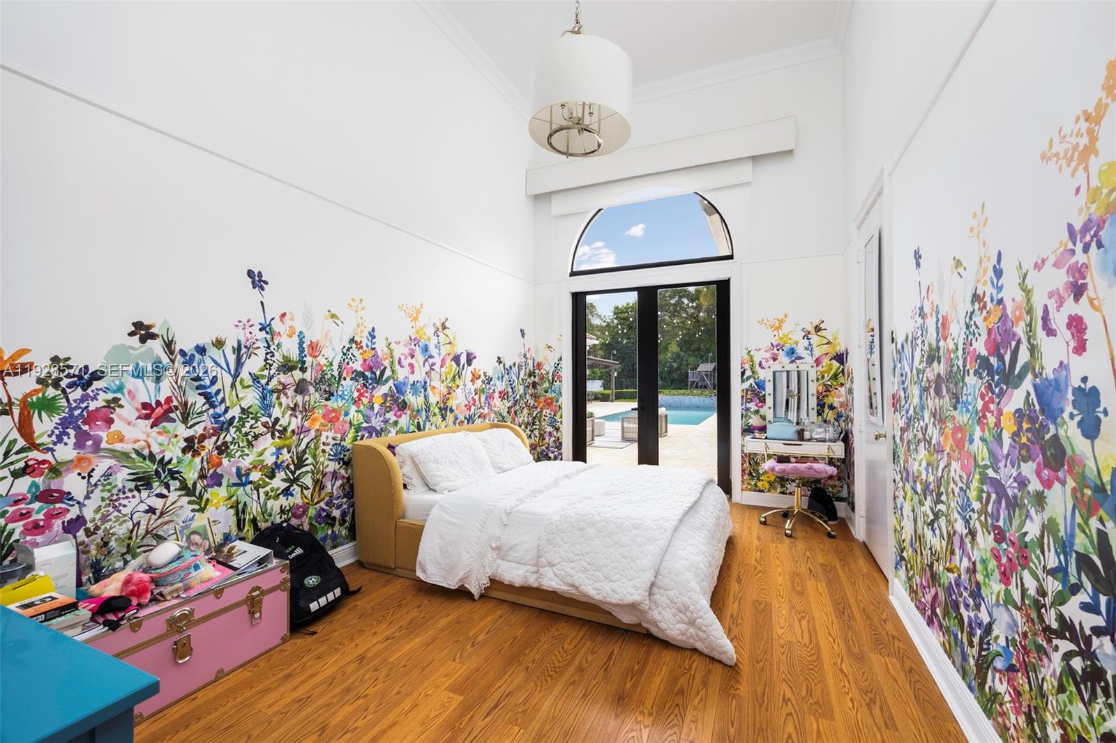 7430 Southwest 66th Street Miami, FL 33143 - Photo 21 of 43 a bed room with a bed and a chandelier