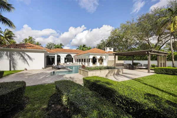 a front view of house with yard and outdoor seating