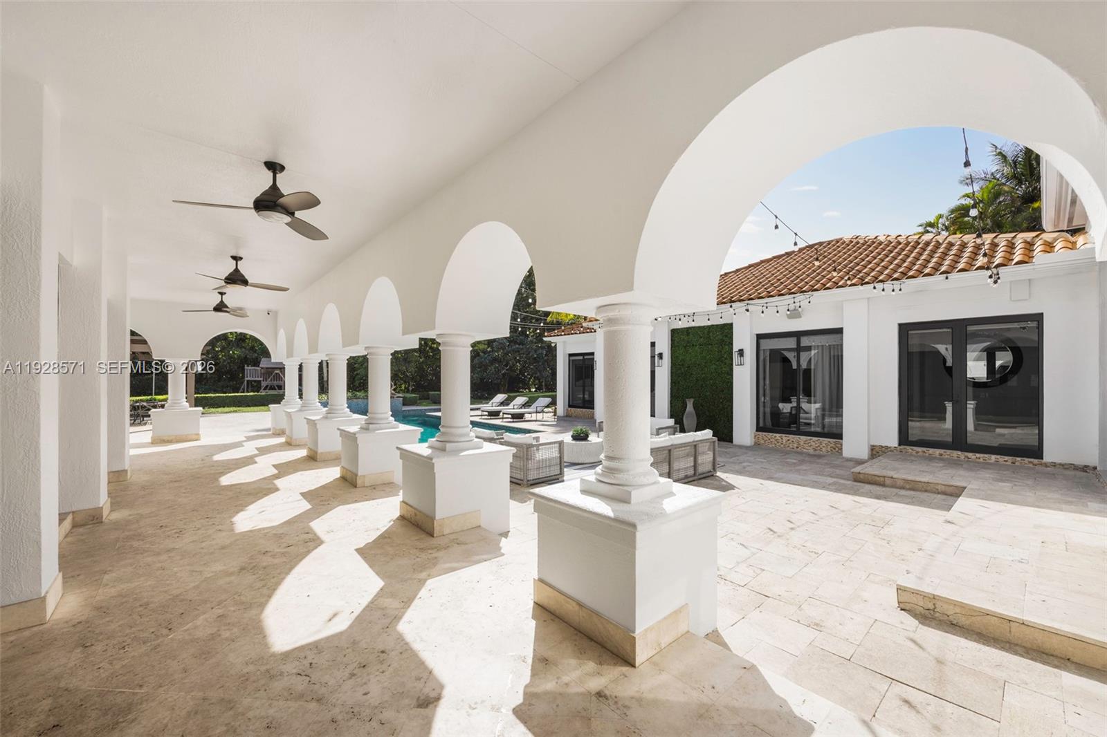 7430 Southwest 66th Street Miami, FL 33143 - Photo 29 of 43 a view of a living room and kitchen floor to ceiling windows