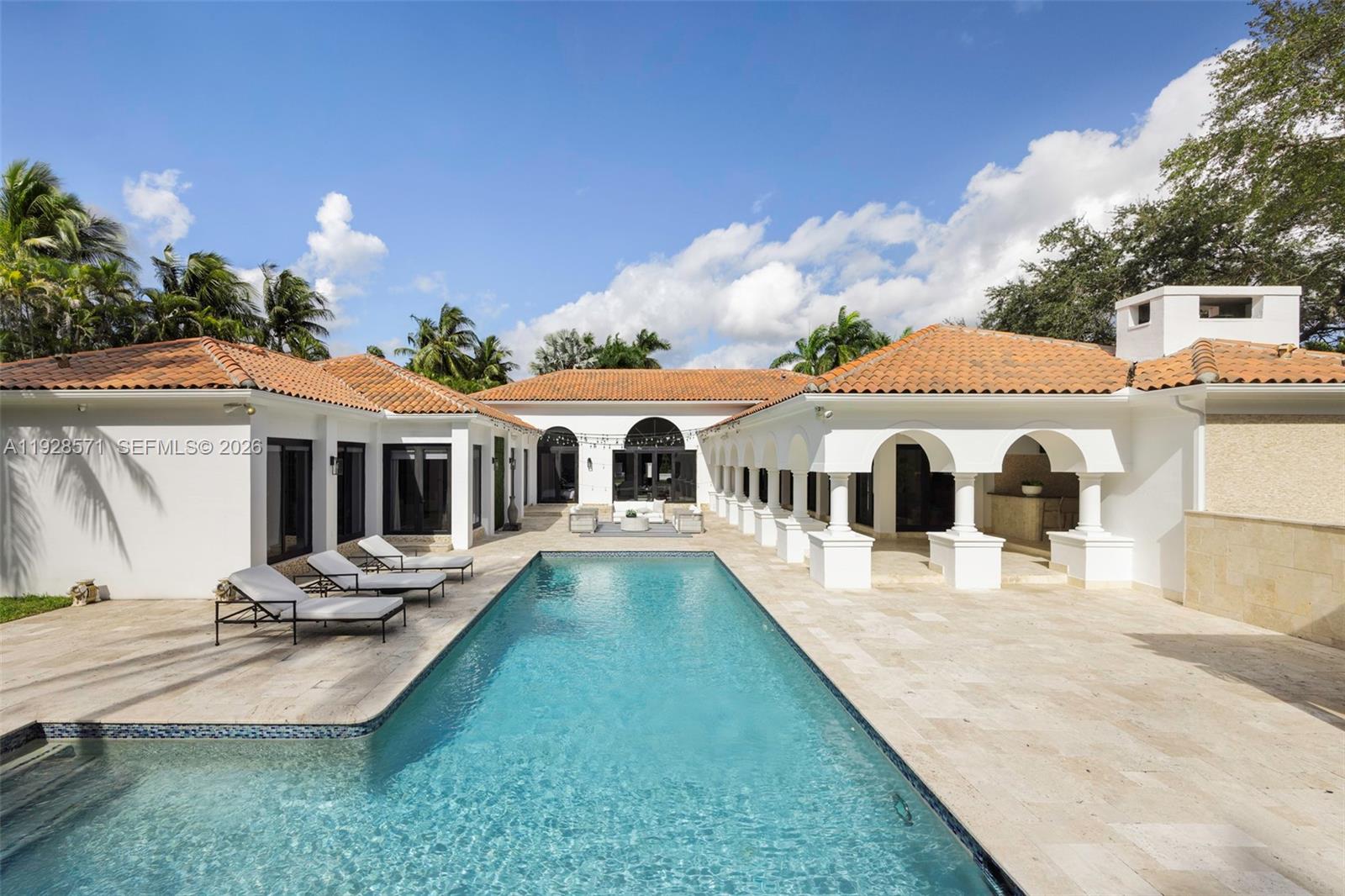 7430 Southwest 66th Street Miami, FL 33143 - Photo 34 of 43 a front view of house with yard entertaining space and outdoor seating