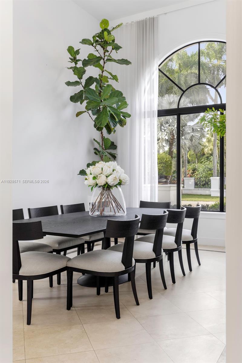 7430 Southwest 66th Street Miami, FL 33143 - Photo 4 of 43 a dining room table furniture and a potted plant