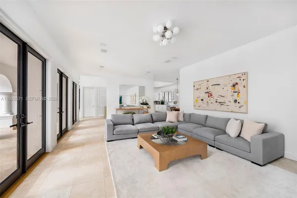 a living room with furniture and a rug
