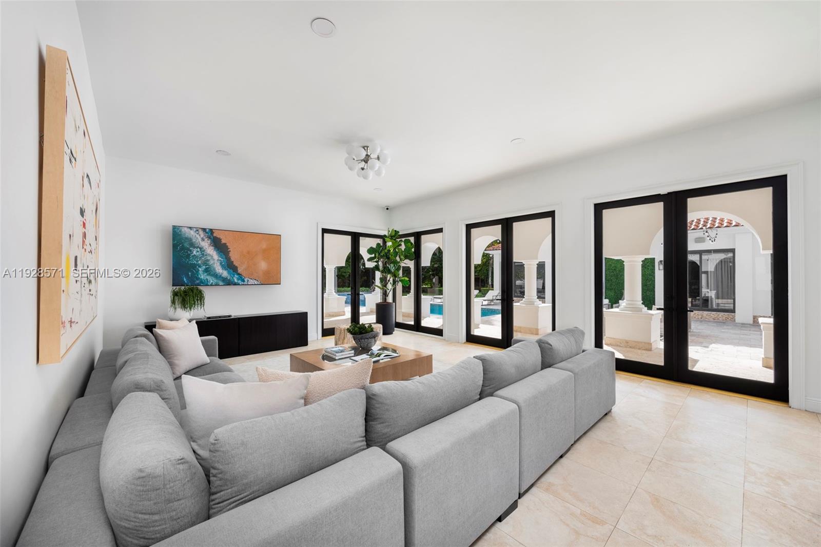 7430 Southwest 66th Street Miami, FL 33143 - Photo 7 of 43 a living room with furniture and a large window