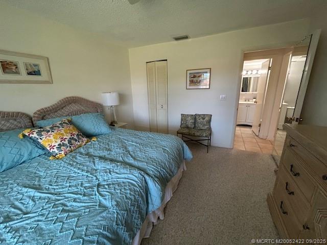 1903 Southwest Palm City Road, Unit H Stuart, FL 34994 - Photo 19 of 31 a bedroom with a bed and wooden floor