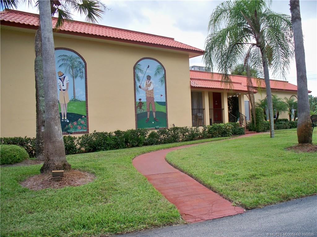 1903 Southwest Palm City Road, Unit H Stuart, FL 34994 - Photo 24 of 31 a front view of a house with garden