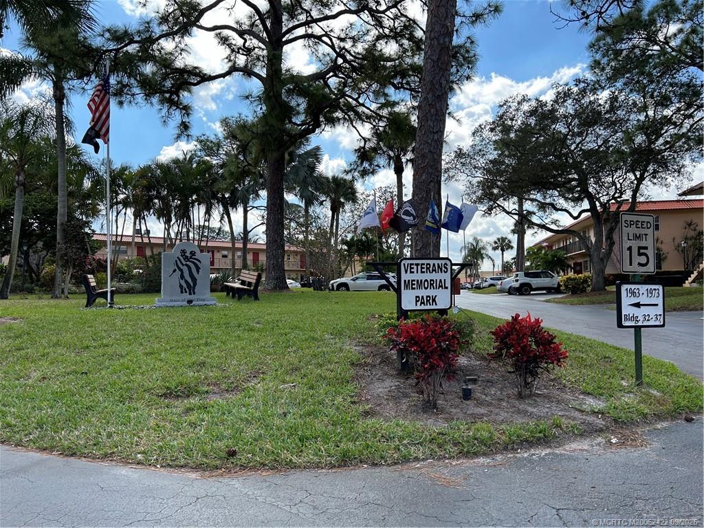 1903 Southwest Palm City Road, Unit H Stuart, FL 34994 - Photo 27 of 31 a garden with flowers and trees