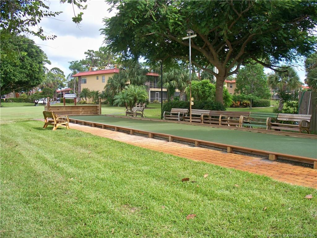1903 Southwest Palm City Road, Unit H Stuart, FL 34994 - Photo 29 of 31 a view of a park with swings and slides