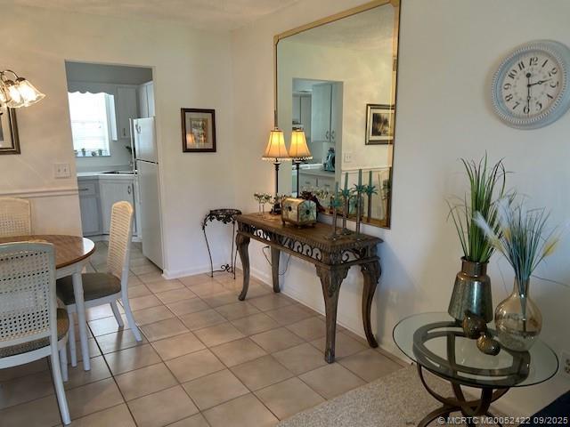 1903 Southwest Palm City Road, Unit H Stuart, FL 34994 - Photo 7 of 31 a view of a livingroom with furniture and a potted plant
