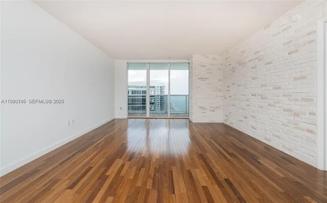 a view of wooden floor in an empty room