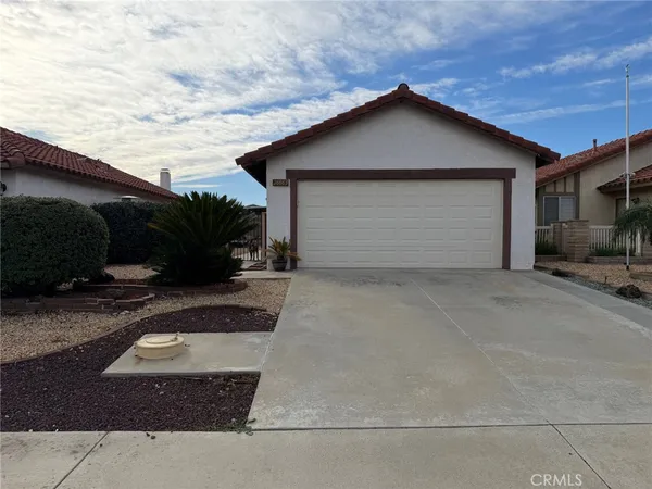 a front view of a house with garage