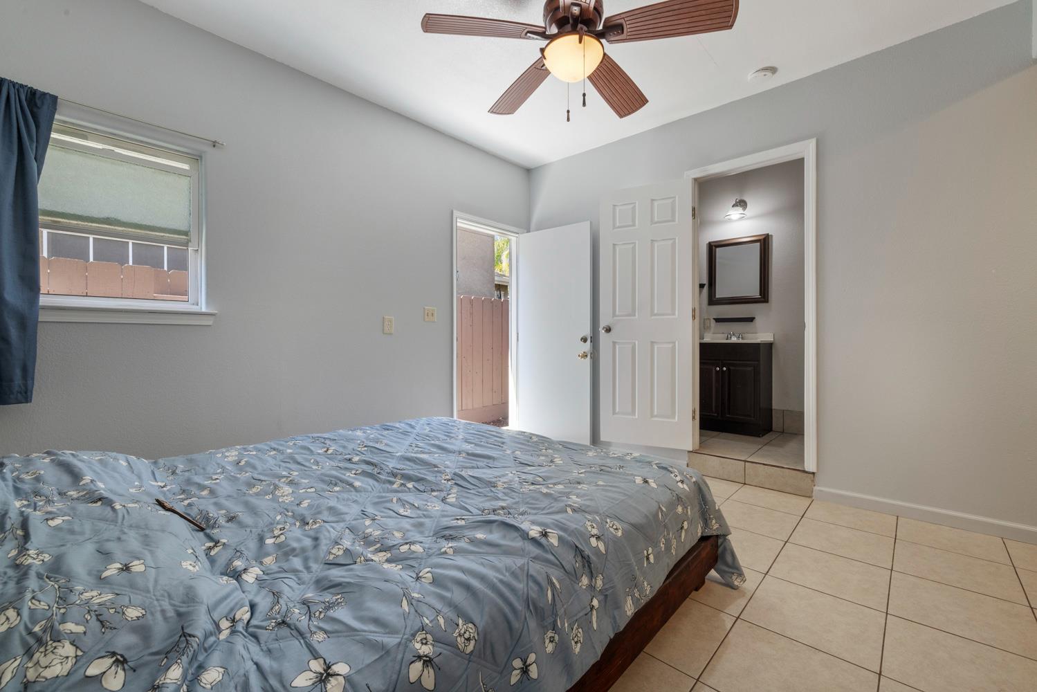 3105 Ripple Court Modesto, CA 95355 - Photo 39 of 46 a bedroom with a bed and a chandelier