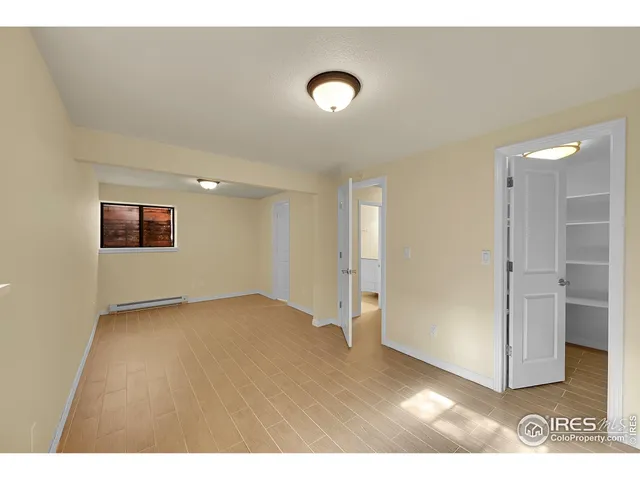 a view of an empty room and window