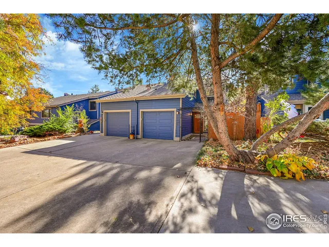 a view of a house with a tree