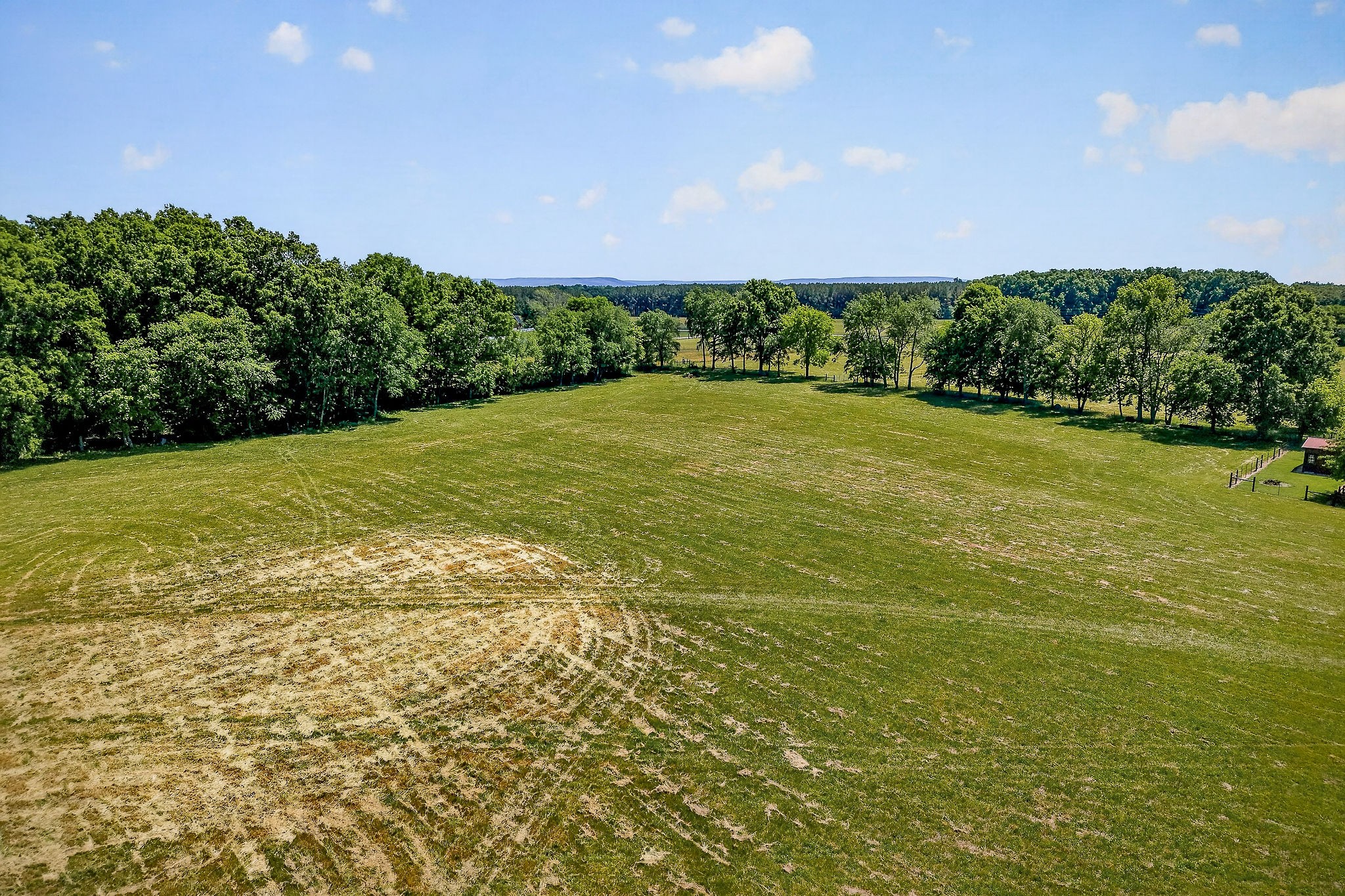 0 Freeze Road Morrison, TN 37357 - Photo 10 of 11 a view of a big yard with an outdoor space and seating area