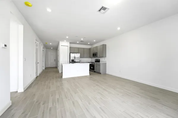a view of kitchen with wooden floor