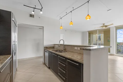 a kitchen with a sink and a refrigerator