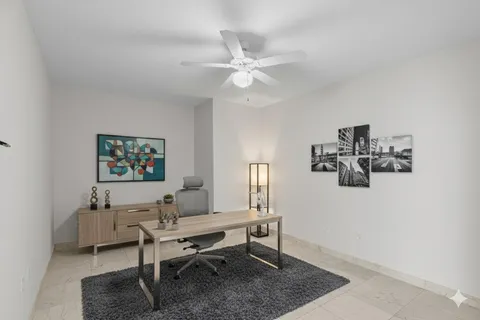 a view of a workspace with furniture