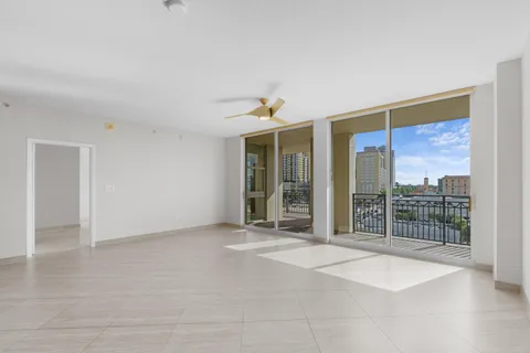 a view of an empty room with glass door