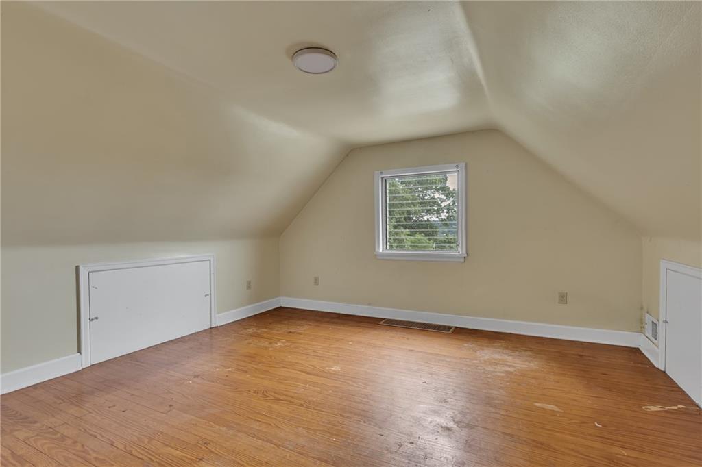 1736 Pierce Street Aliquippa, PA 15001 - Photo 14 of 19 an empty room with wooden floor and windows
