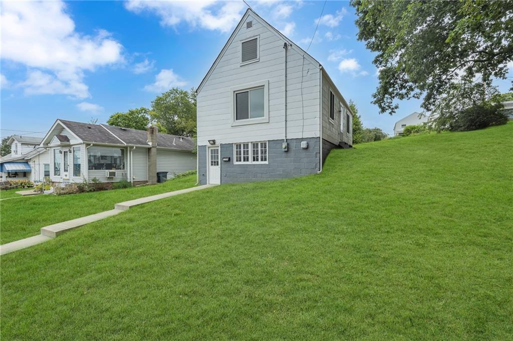 1736 Pierce Street Aliquippa, PA 15001 - Photo 2 of 19 a view of a yard in front of house