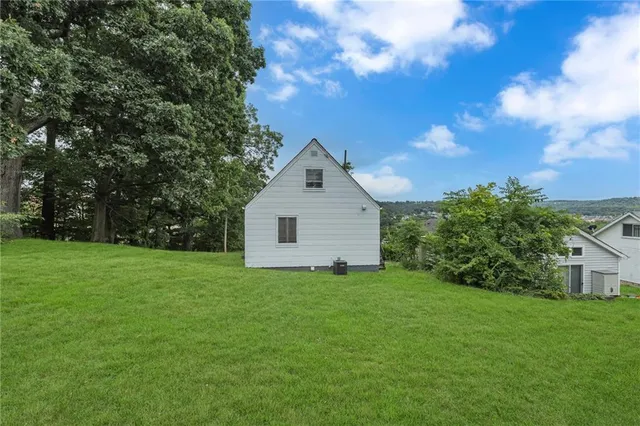 a view of a backyard of the house