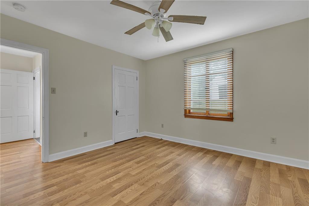 1736 Pierce Street Aliquippa, PA 15001 - Photo 10 of 19 wooden floor in an empty room with a window