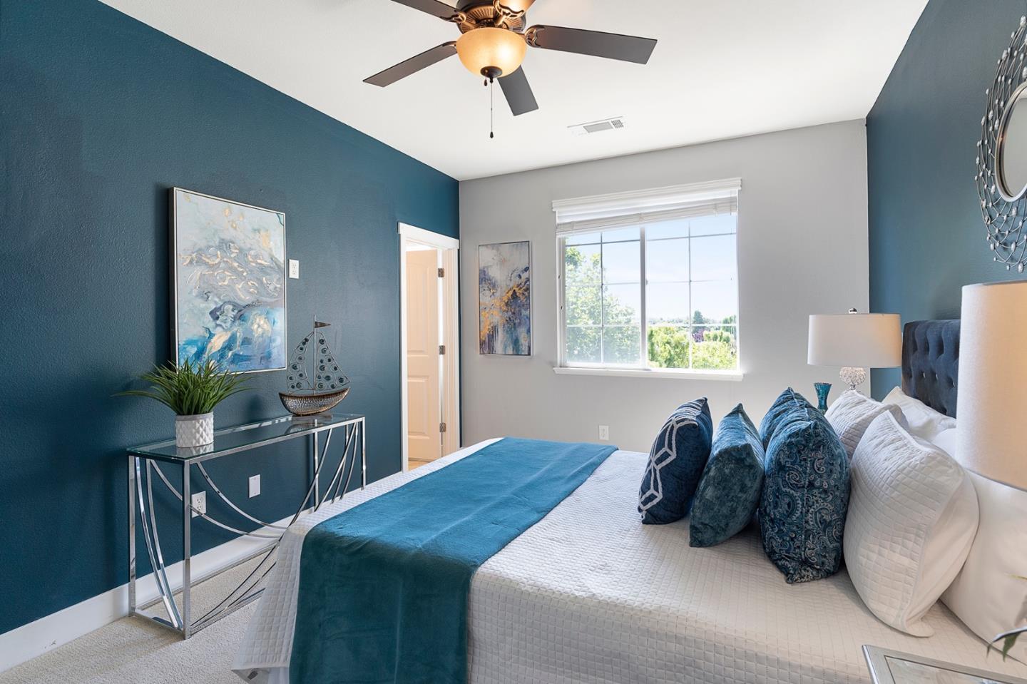 407 Topaz Terrace Sunnyvale, CA 94089 - Photo 23 of 33 a bed room with a bed window and a chandelier