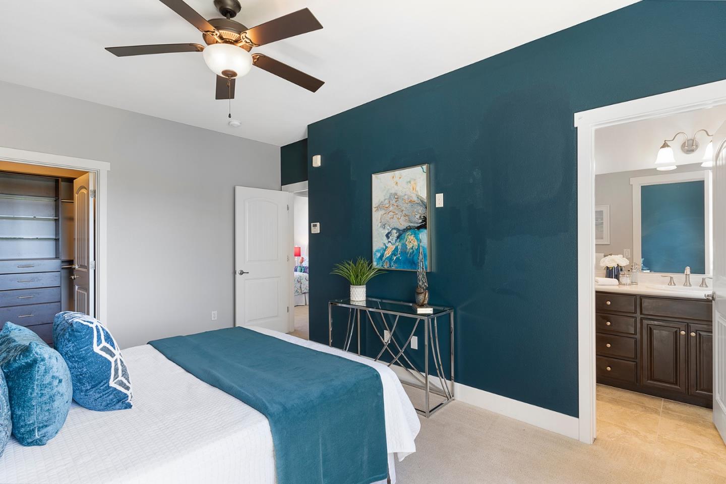 407 Topaz Terrace Sunnyvale, CA 94089 - Photo 24 of 33 a bedroom with a bed and a chandelier