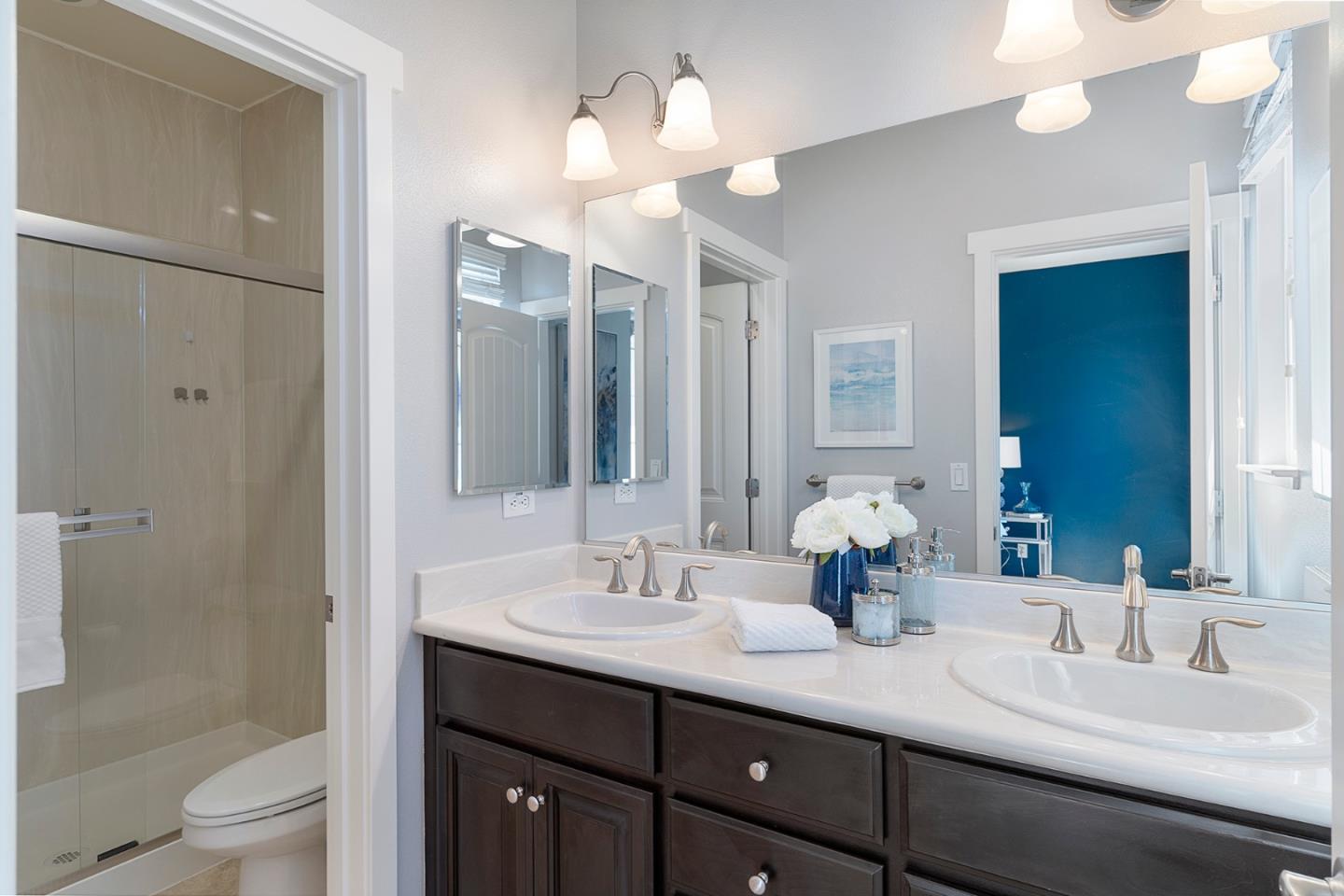 407 Topaz Terrace Sunnyvale, CA 94089 - Photo 26 of 33 a bathroom with a double vanity sink mirror and toilet