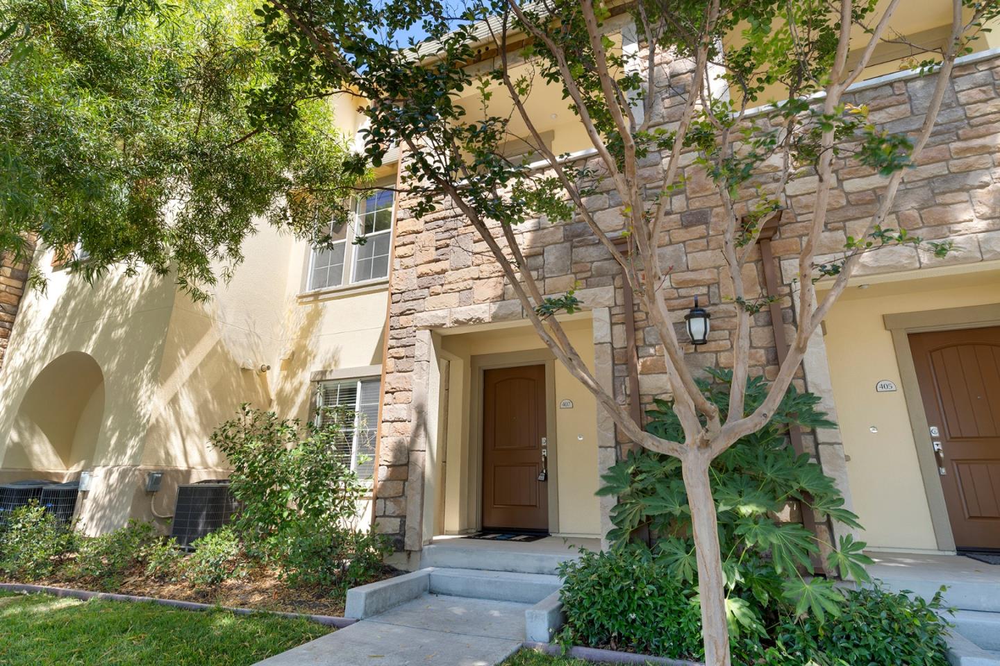 407 Topaz Terrace Sunnyvale, CA 94089 - Photo 4 of 33 a front view of a house with a garden