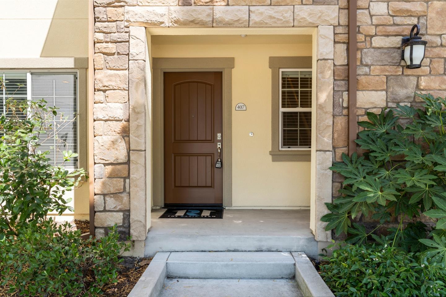 407 Topaz Terrace Sunnyvale, CA 94089 - Photo 5 of 33 a front view of a house with a garden