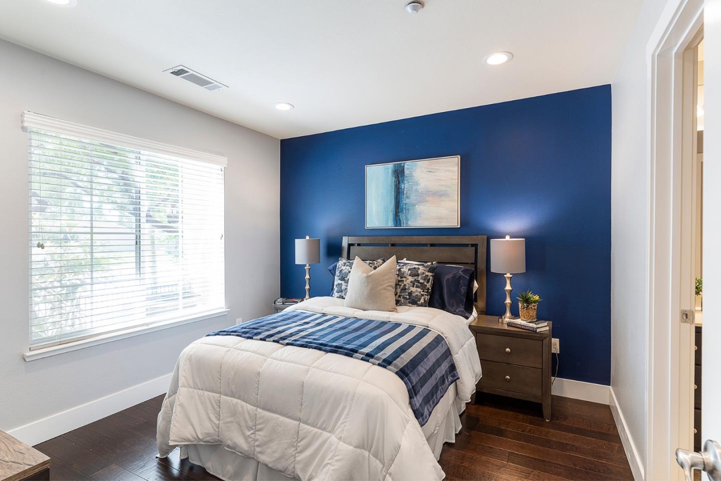407 Topaz Terrace Sunnyvale, CA 94089 - Photo 7 of 33 a bed sitting in a bedroom next to a window
